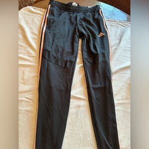 New! Adidas Tiro black tapered fit pink stripe. Size small.